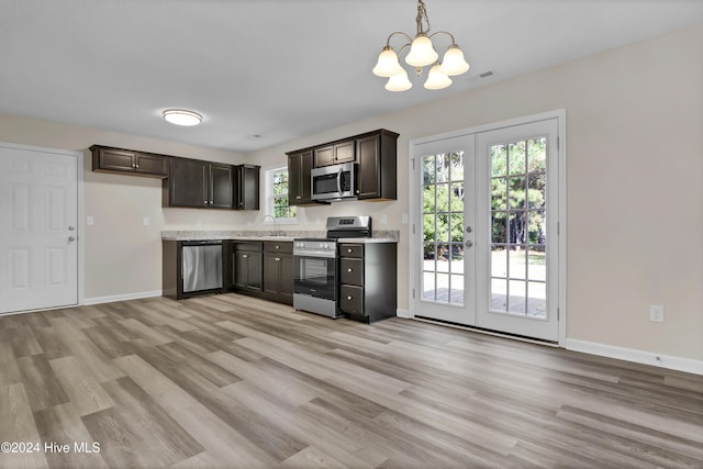 1912 Paulette Rd, Morehead City, NC 28557 - kitchen featuring stainless steel appliances, a sink, baseboards, and light wood-type flooring