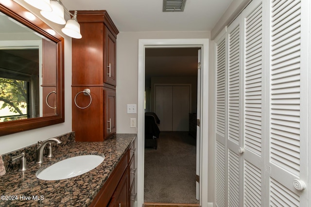 bathroom featuring visible vents and vanity