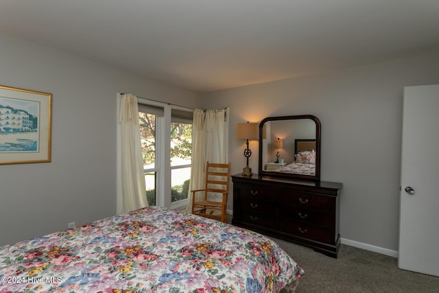 carpeted bedroom with baseboards