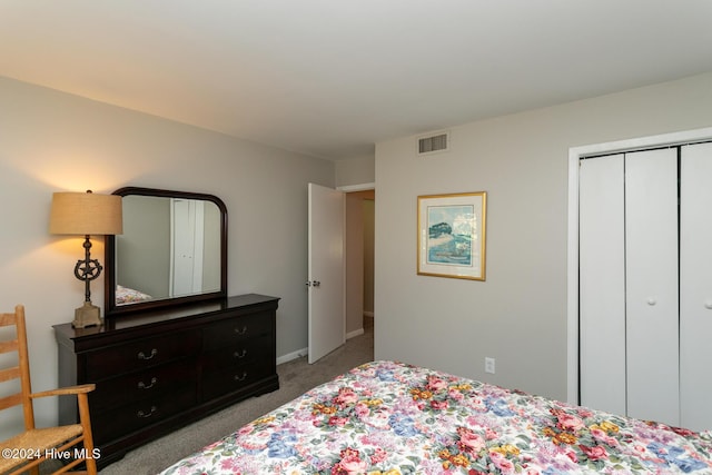 bedroom featuring carpet flooring, a closet, visible vents, and baseboards