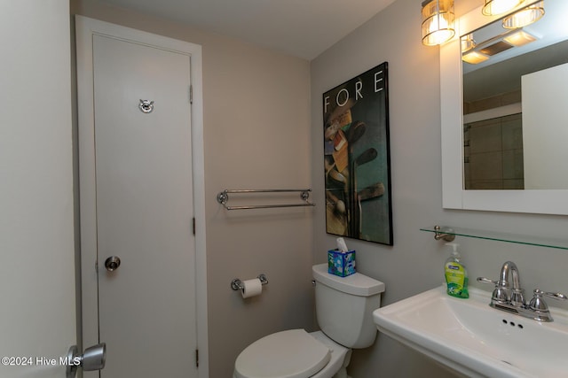 bathroom featuring toilet and a sink
