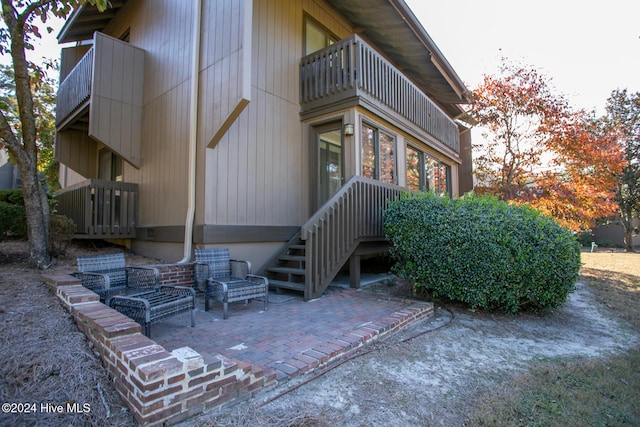 exterior space with a patio and a balcony