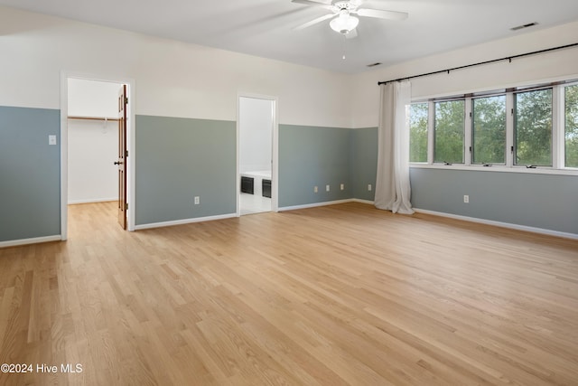 spare room with ceiling fan and light hardwood / wood-style floors