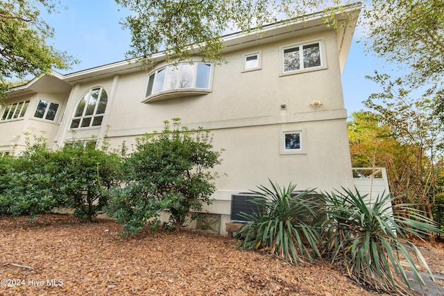 view of property exterior featuring central AC