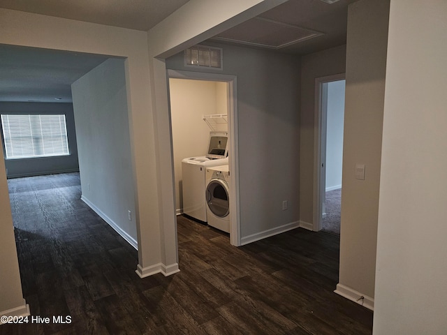 washroom featuring separate washer and dryer and dark hardwood / wood-style flooring