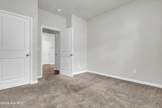 unfurnished bedroom with carpet floors