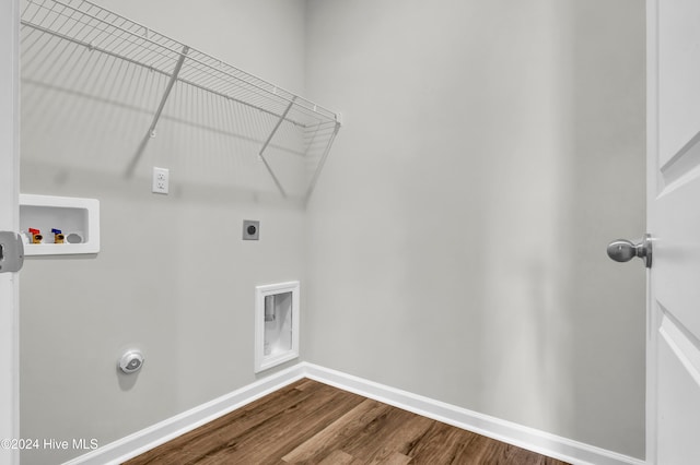 laundry area with electric dryer hookup, hardwood / wood-style flooring, and washer hookup