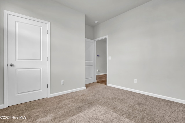 unfurnished bedroom with carpet flooring