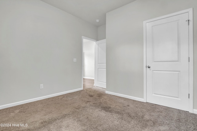 unfurnished bedroom featuring carpet