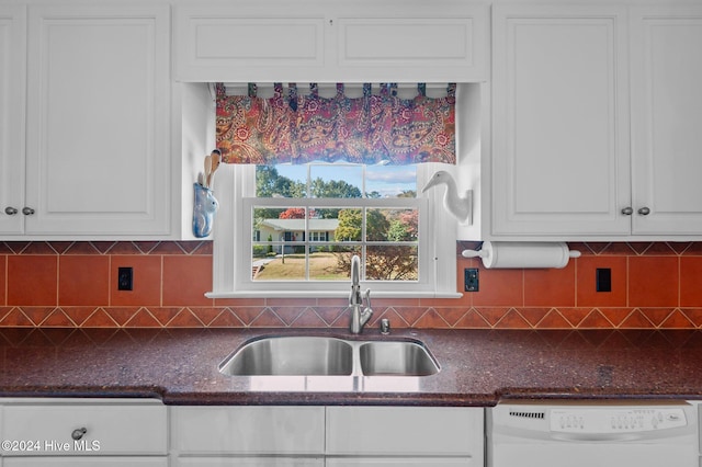 kitchen with white cabinetry, tasteful backsplash, sink, and white dishwasher