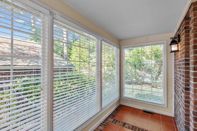 unfurnished sunroom featuring plenty of natural light