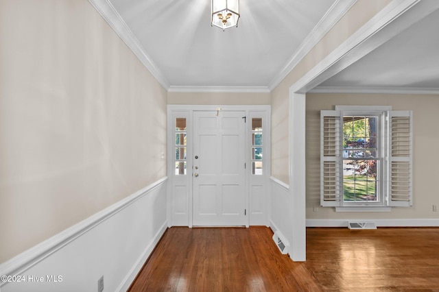 entrance foyer featuring hardwood / wood-style flooring and crown molding