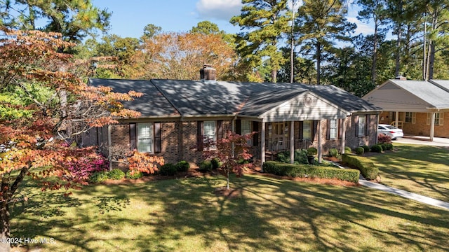 ranch-style house featuring a front lawn