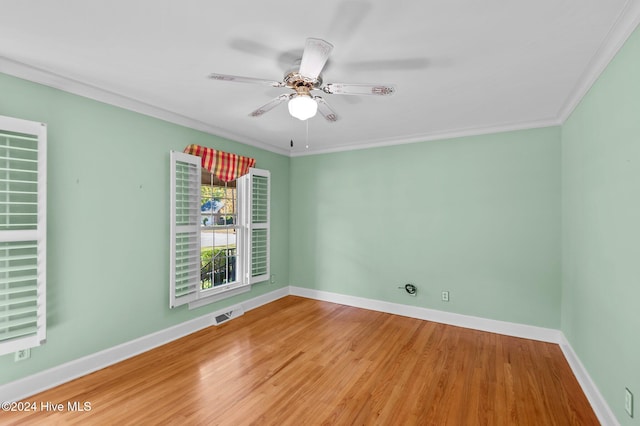 unfurnished room with hardwood / wood-style flooring, ceiling fan, and crown molding