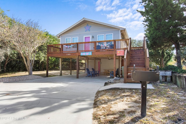 view of front of property with a wooden deck