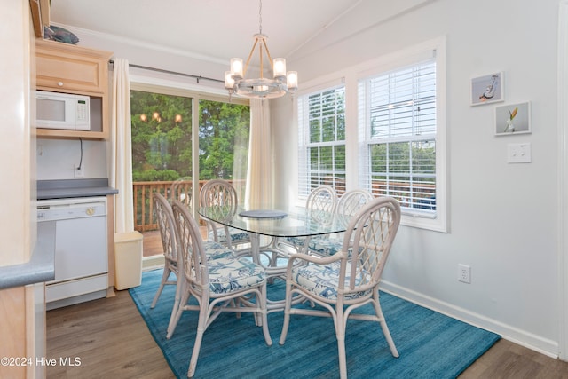 dining room with a chandelier and dark hardwood / wood-style floors