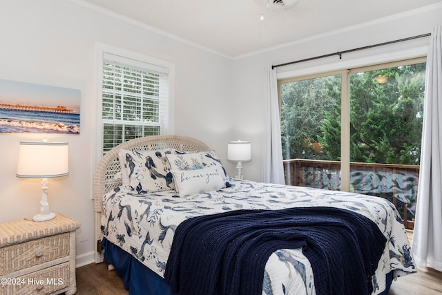 bedroom with hardwood / wood-style flooring and crown molding