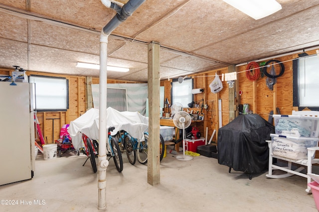 basement with white fridge