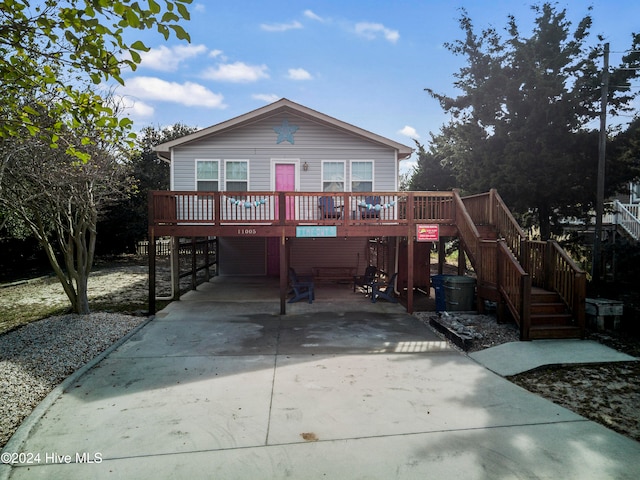 view of front of property with a wooden deck