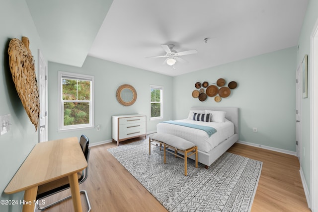 bedroom featuring light wood-type flooring and ceiling fan