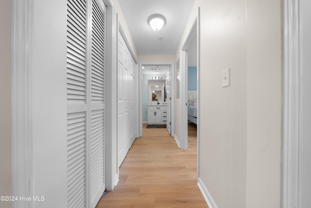 hall with light hardwood / wood-style flooring