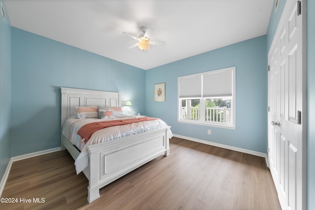 bedroom with wood-type flooring and ceiling fan