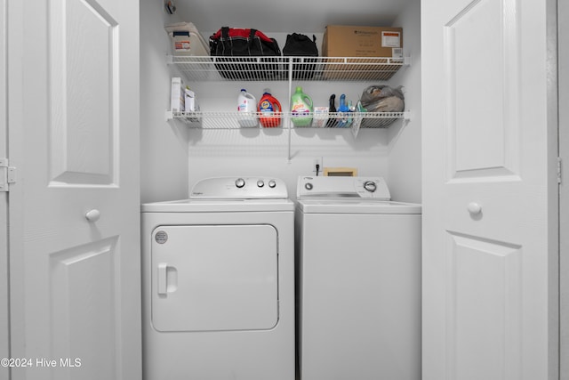 laundry area featuring washing machine and clothes dryer