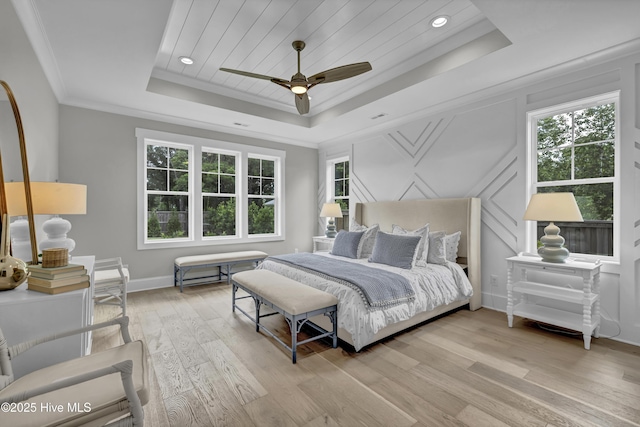 612 Waterstone Dr, Wilmington, NC 28411 - bedroom with a raised ceiling, multiple windows, light wood-style flooring, crown molding, and a ceiling fan