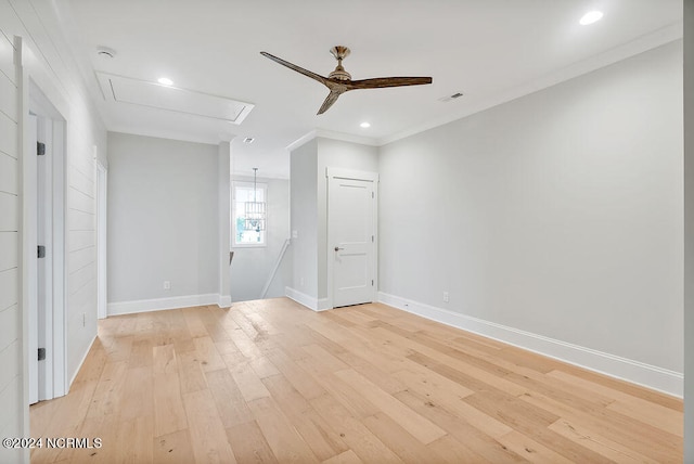 empty room with crown molding, light hardwood / wood-style flooring, and ceiling fan