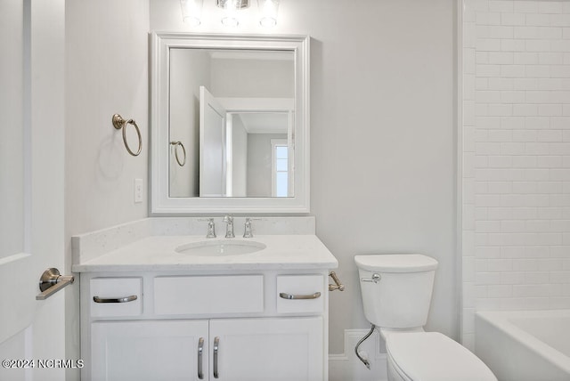 full bathroom featuring vanity, toilet, and tiled shower / bath combo