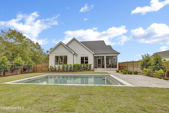 612 Waterstone Dr, Wilmington, NC 28411 - rear view of property featuring a sunroom, a fenced backyard, a patio, and roof with shingles