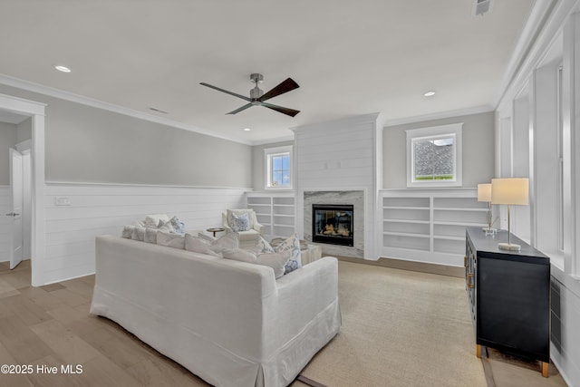 612 Waterstone Dr, Wilmington, NC 28411 - living area with a ceiling fan, a premium fireplace, ornamental molding, light wood-type flooring, and recessed lighting