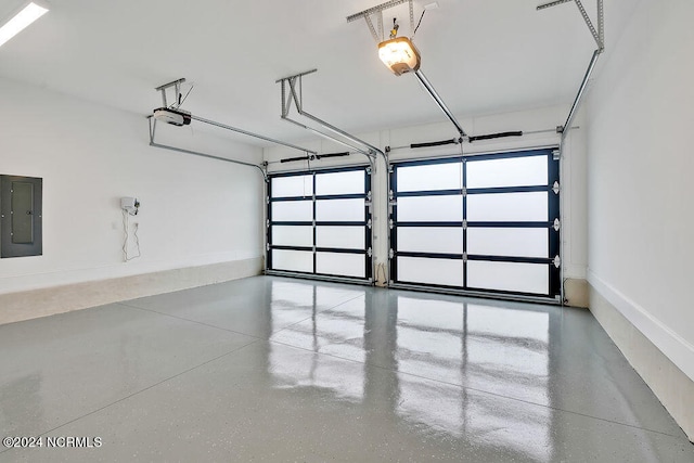 garage with electric panel and a garage door opener