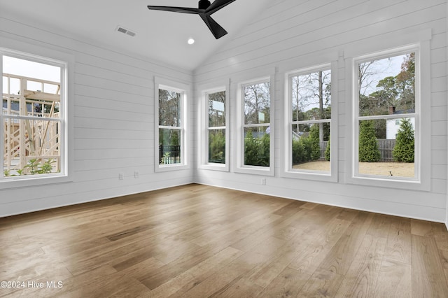 unfurnished sunroom with ceiling fan and lofted ceiling