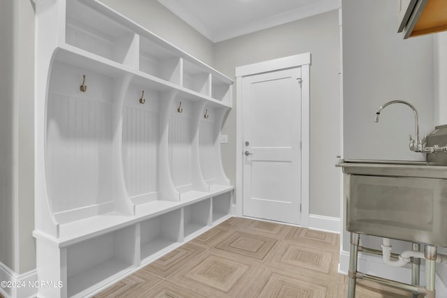 mudroom featuring light parquet floors and sink