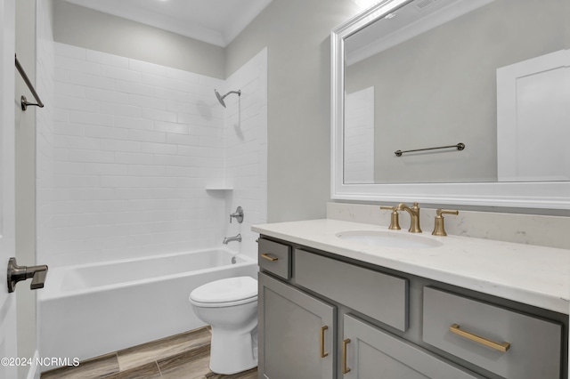 full bathroom featuring shower / bathing tub combination, wood-type flooring, toilet, vanity, and crown molding