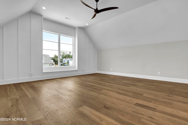 bonus room featuring ceiling fan, wood-type flooring, and vaulted ceiling