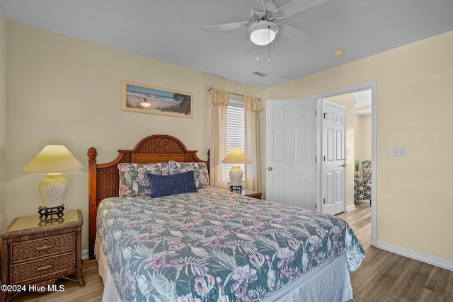 bedroom featuring light hardwood / wood-style floors and ceiling fan