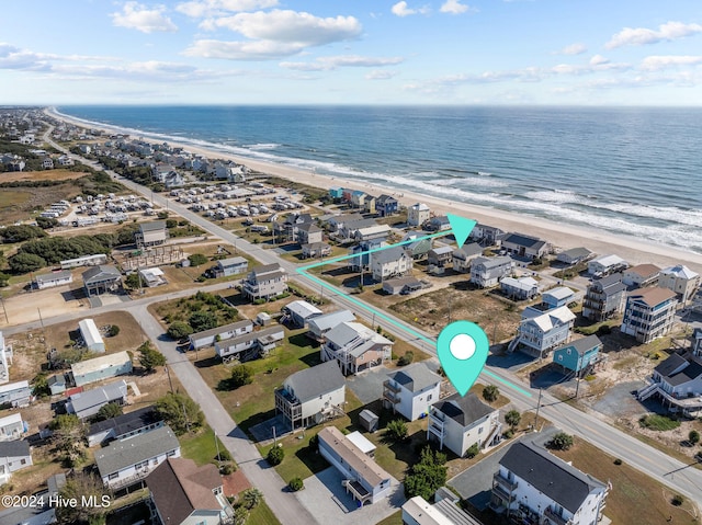 aerial view featuring a water view and a beach view