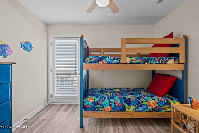 bedroom with wood-type flooring and ceiling fan