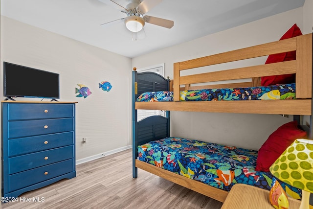 bedroom featuring light hardwood / wood-style flooring and ceiling fan