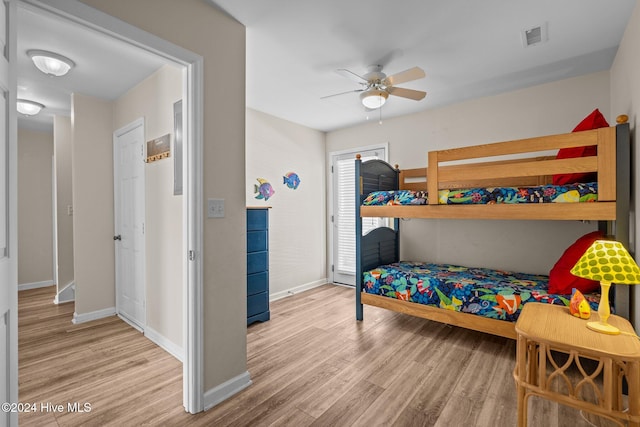 bedroom with ceiling fan and light wood-type flooring