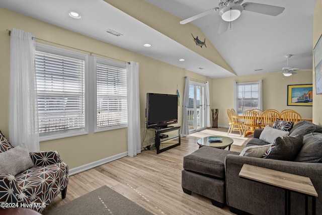 living room with lofted ceiling, light wood-type flooring, and ceiling fan