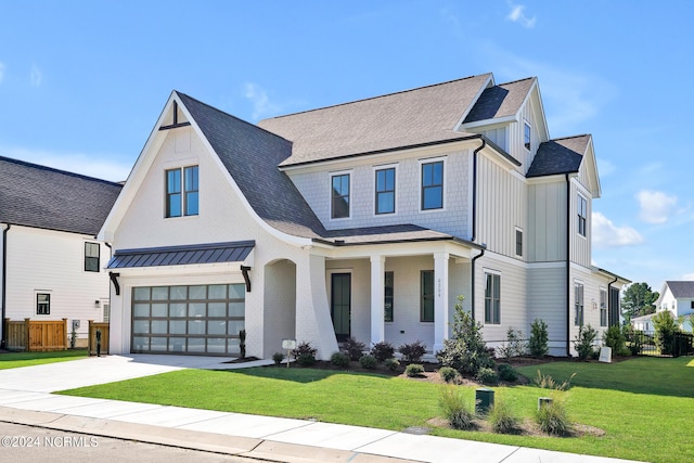 modern inspired farmhouse featuring a garage and a front lawn