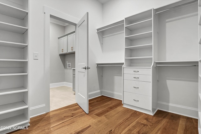 walk in closet featuring wood-type flooring