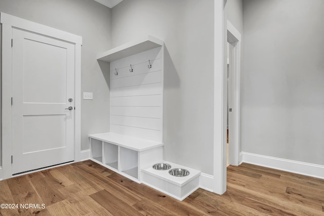 mudroom with light hardwood / wood-style floors