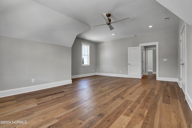 bonus room featuring lofted ceiling, hardwood / wood-style floors, and ceiling fan