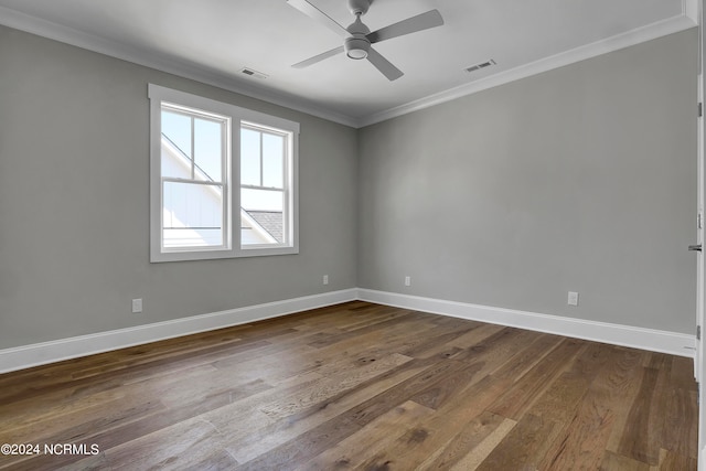 empty room featuring ceiling fan, hardwood / wood-style flooring, and crown molding