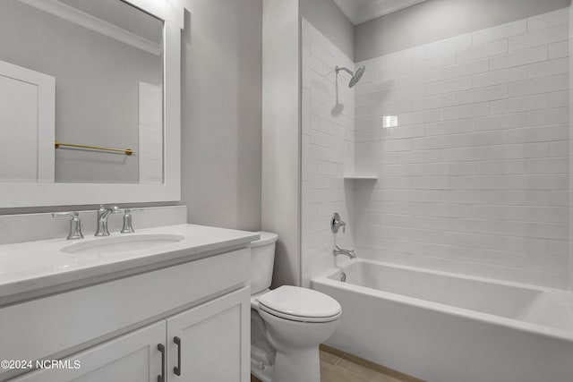 full bathroom featuring toilet, ornamental molding, vanity, tiled shower / bath combo, and tile patterned floors