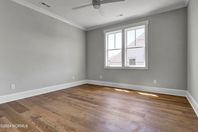 unfurnished room featuring ceiling fan, crown molding, and hardwood / wood-style floors